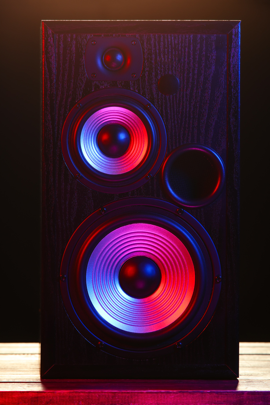 Modern Loudspeaker on Table against Black Background
